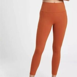 Athleta Salutation Stash Tight 25”inseam Canyon Orange Size Medium EUC $109 Ret